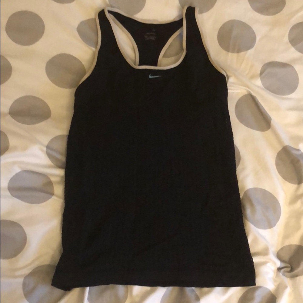Exercise tank top with built in chest support.